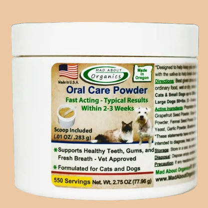 Jar of oral care powder on a wooden surface with a green leafy background