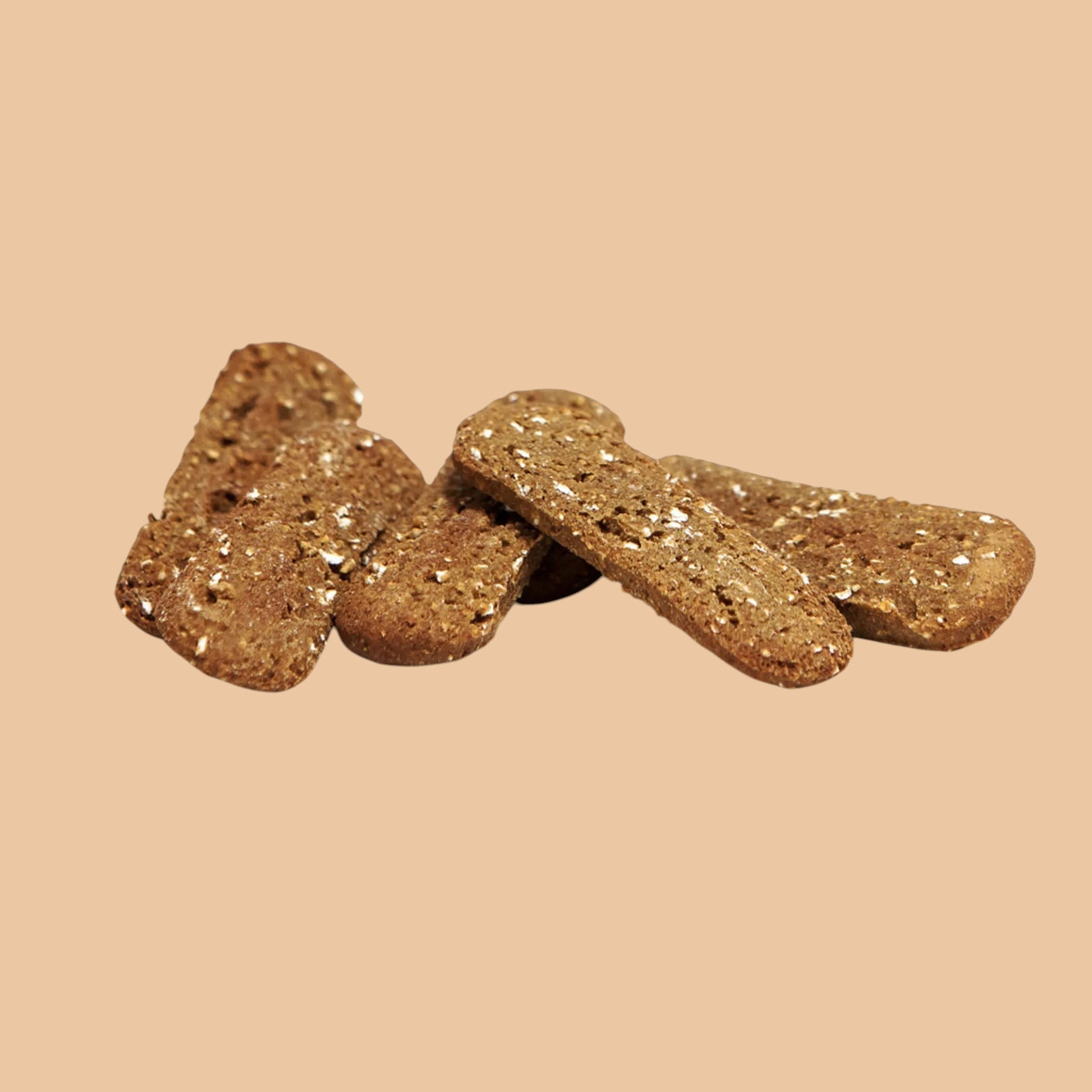 Pets Paradise Love crispy oatmeal chip dog treats, plant-based vegan snacks for dogs on a light tan background.